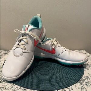 Nike White, Teal, and Orange Golf Shoes